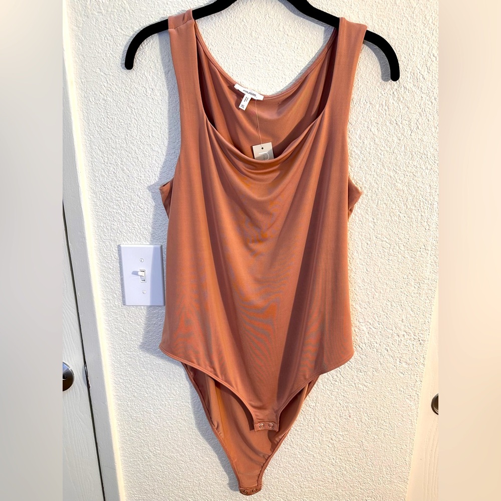 Beautiful taupe Sleeveless Bodysuit by Maurice’s. NWT.